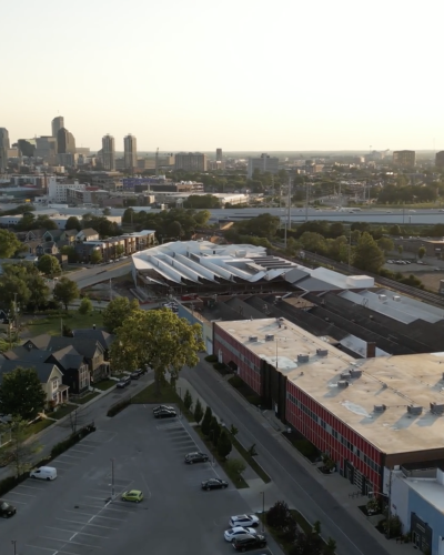 An arial image of the Factory Arts District Complex with downtown Indianapolis in the distance.